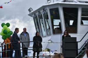 The vessel’s namesake, Jamie Ann Goldberg, the daughter of Saltchuk co-founder Fred Goldberg, addressed the crowd gathered at Nichols Brothers last weekend to christen the vessel. Also pictured: David Pearson, Clergy; Gavin Higgins, CEO Nichols Brothers; Janic Trepanier, Naval Architect and Project Manager, Foss.