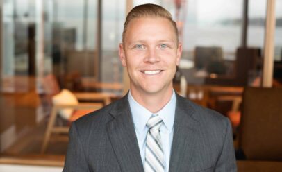Art poses for a portrait in a nice suit.