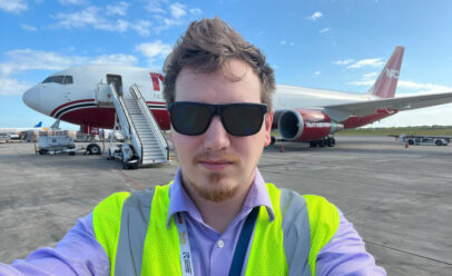 Brian Stroble standing in front of a NAC airplane