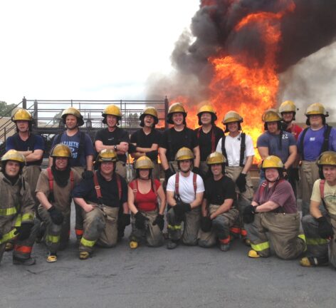 Karen Hays posing for a group photo at an Advanced Maritime Fire Fighting School in May 2013 in Texas.